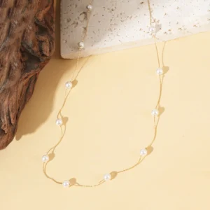 Sautoir doré perles blanches